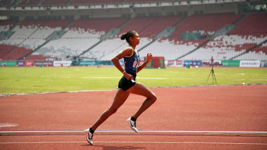 athlete running on stadium