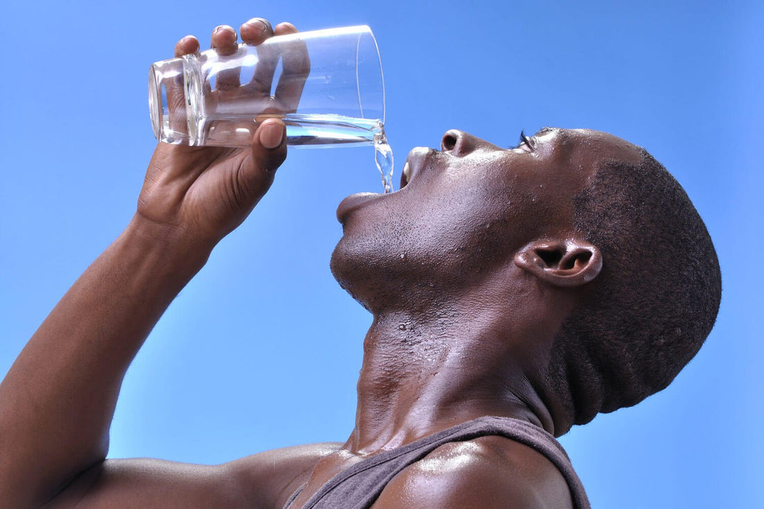 Athlete drinking water from a glass