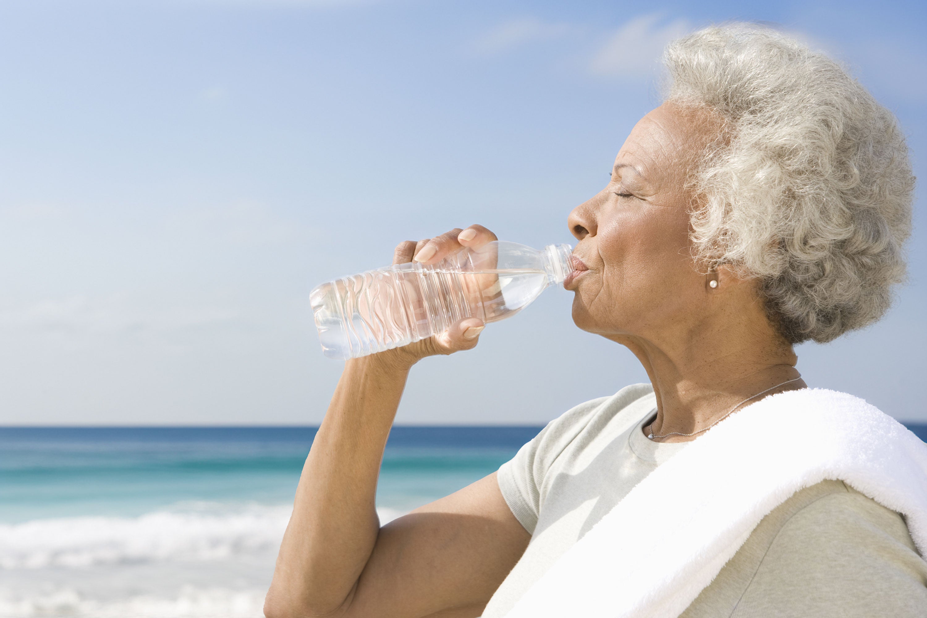 elderly woman drinking hydrogen water