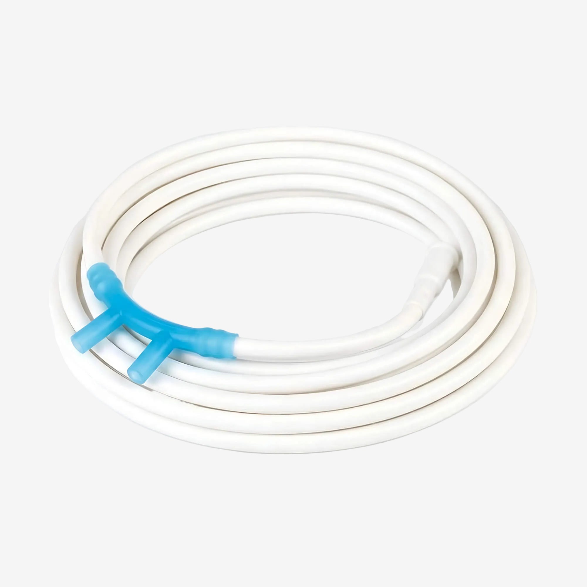 Coiled white nasal cannula with a blue nasal prongs on a light gray background