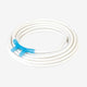 Coiled white nasal cannula with a blue nasal prongs on a light gray background