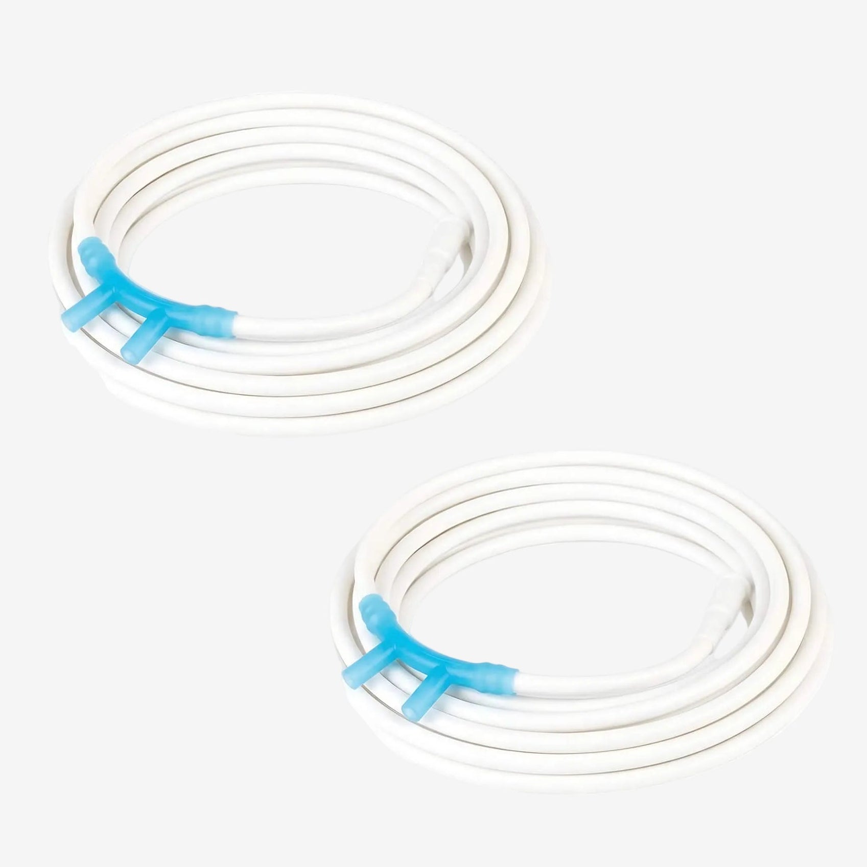 Two coiled white nasal cannulas with blue connectors on a white background