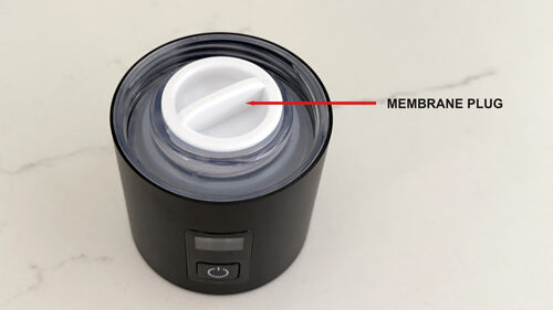 Black device with a white membrane plug labeled on a light gray background