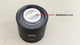 Black device with a white membrane plug labeled on a light gray background