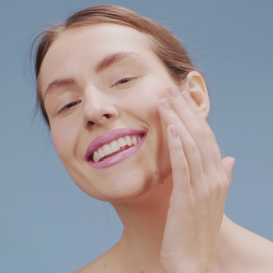 girl applying serum on face