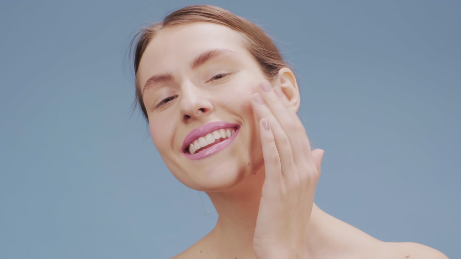 girl applying serum on face