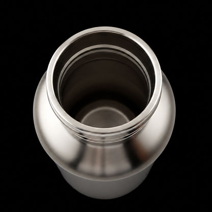 Silver thermos bottle on a black background