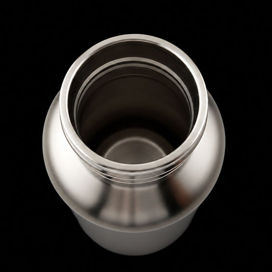 Silver thermos bottle on a black background