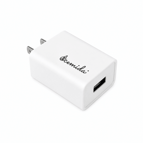 A white rectangular Ocemida USB wall charger with a two-prong plug and a black USB-A port, shown on a clean white background.